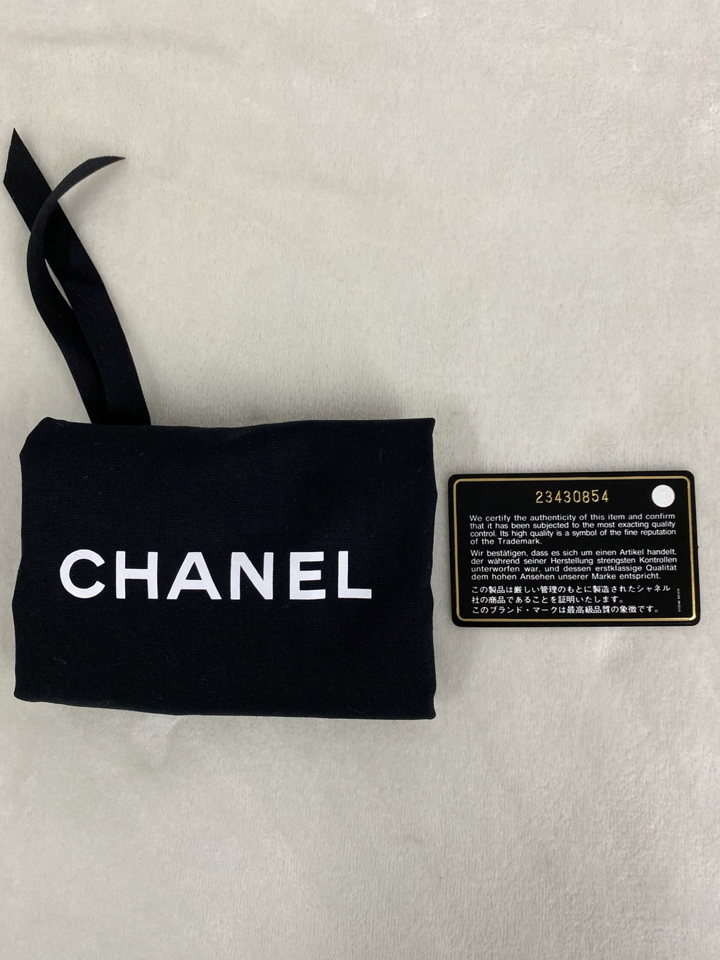 CHANEL Lambskin Enamel Logo Plate Clutch with Chain