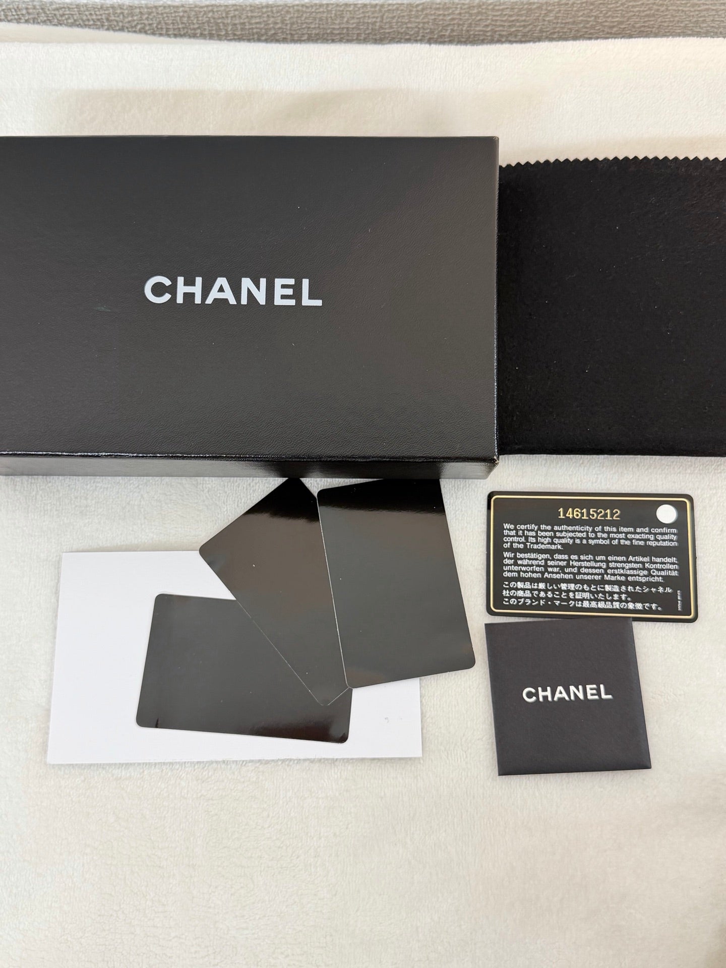 CHANEL Patent Camellia Bifold Wallet