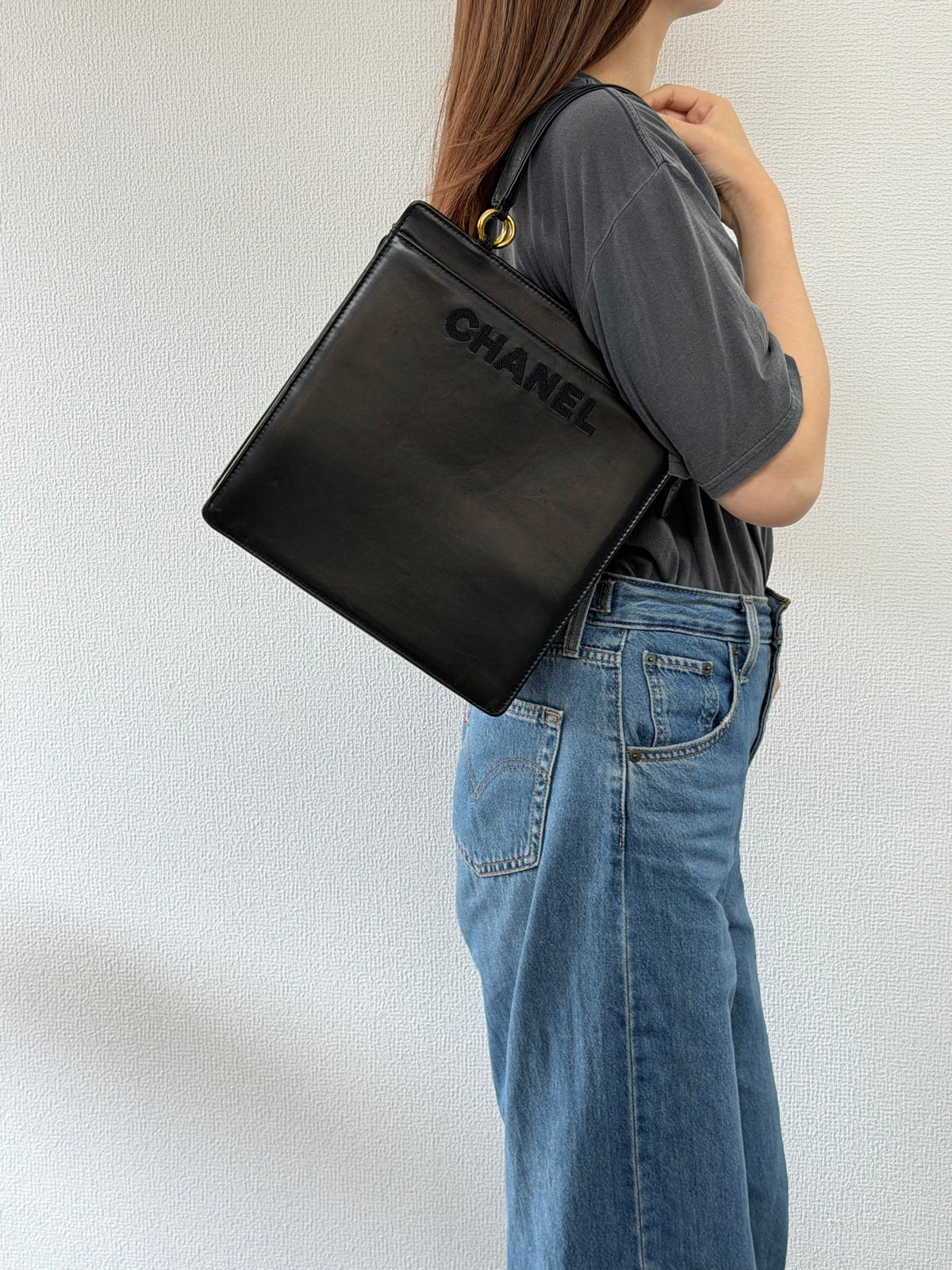 CHANEL Black Leather Square Tote Bag with Embossed Logo