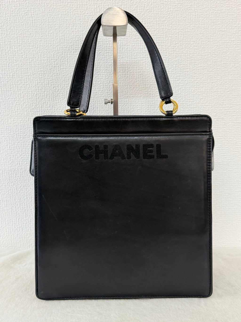 CHANEL Black Leather Square Tote Bag with Embossed Logo