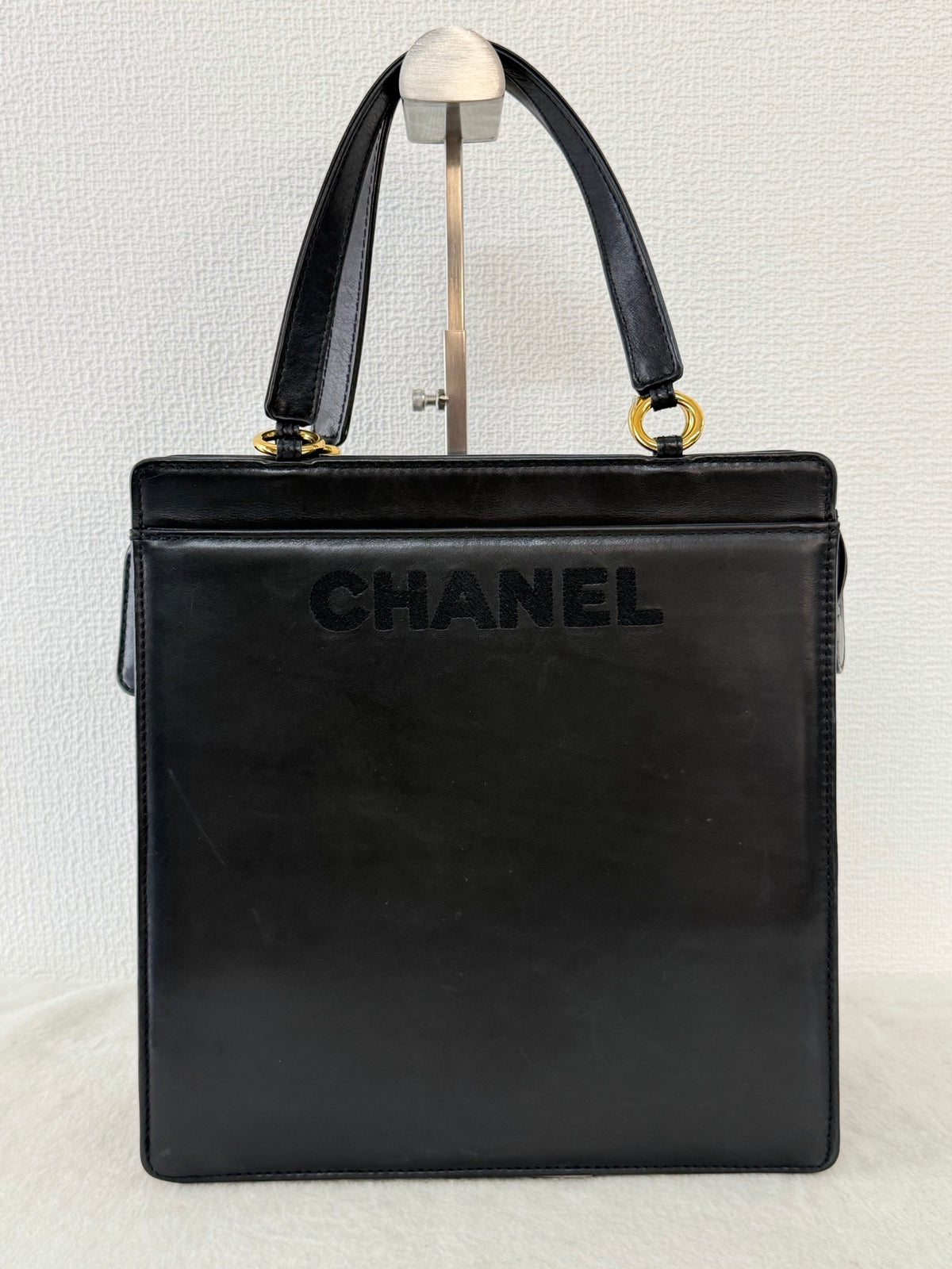 CHANEL Black Leather Square Tote Bag with Embossed Logo