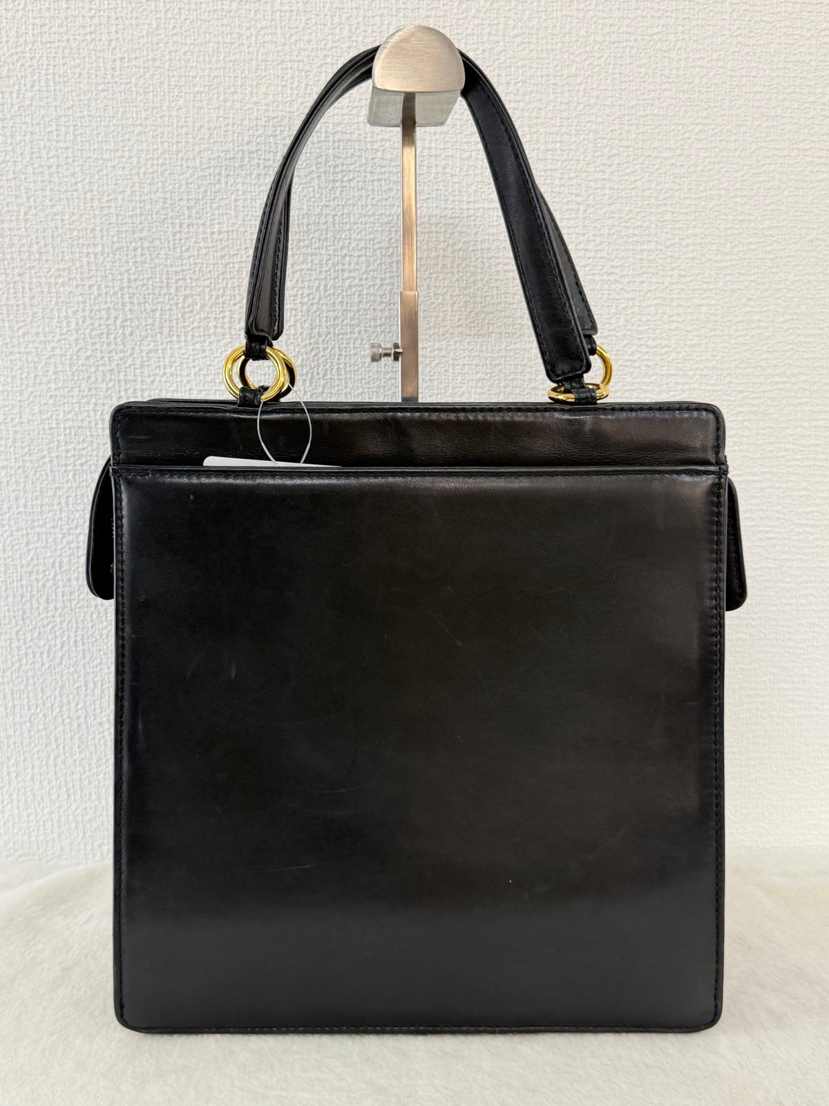 CHANEL Black Leather Square Tote Bag with Embossed Logo