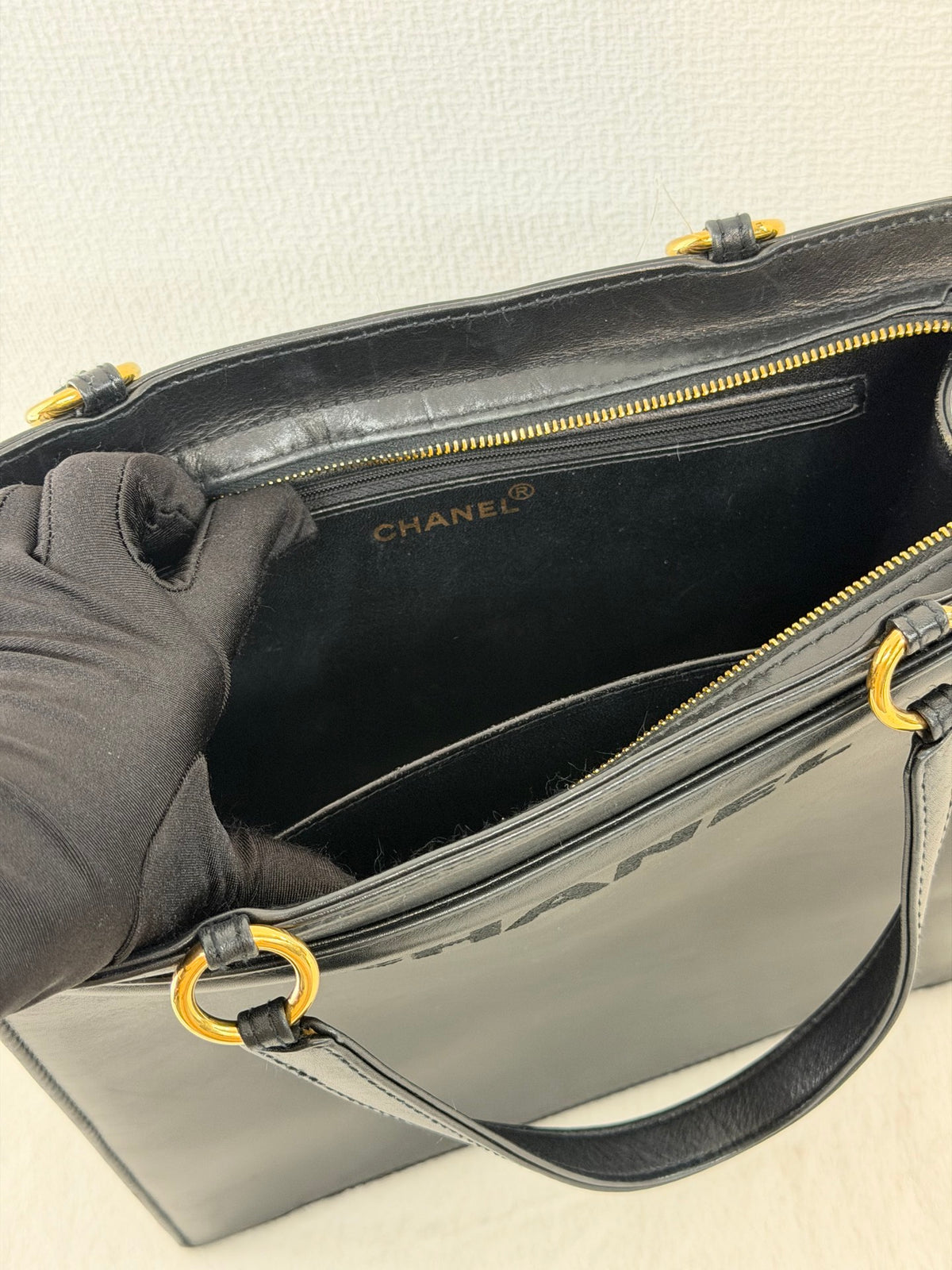 CHANEL Black Leather Square Tote Bag with Embossed Logo