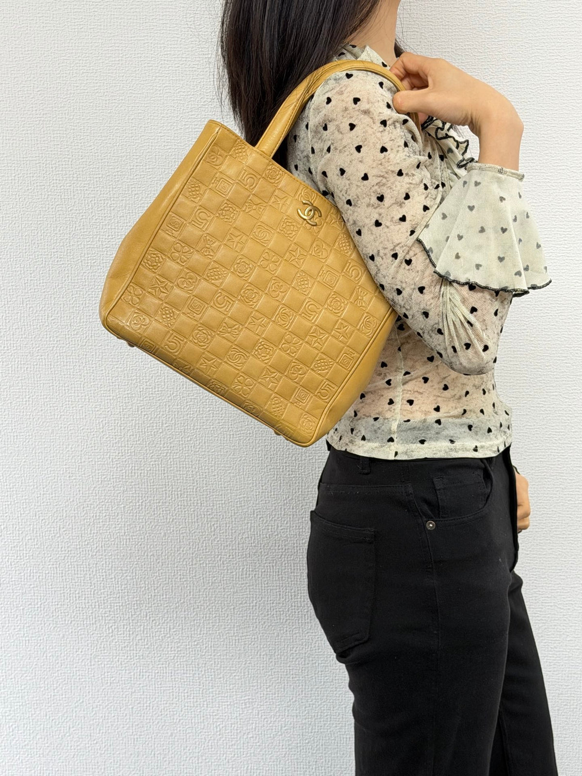 CHANEL Icon Line Embossed Tote Bag