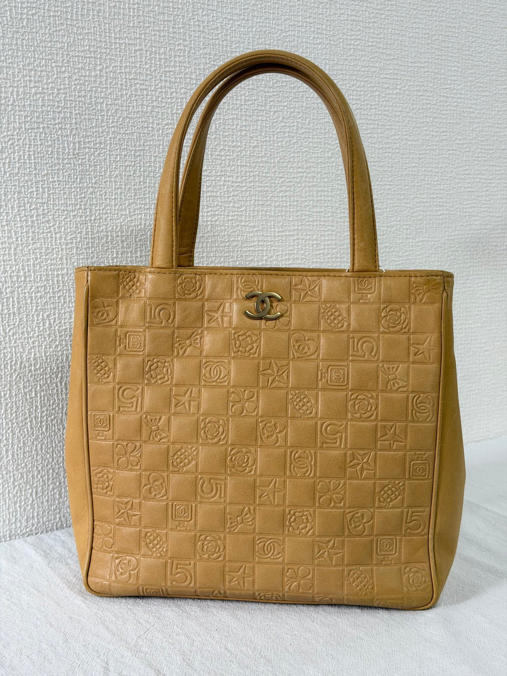 CHANEL Icon Line Embossed Tote Bag