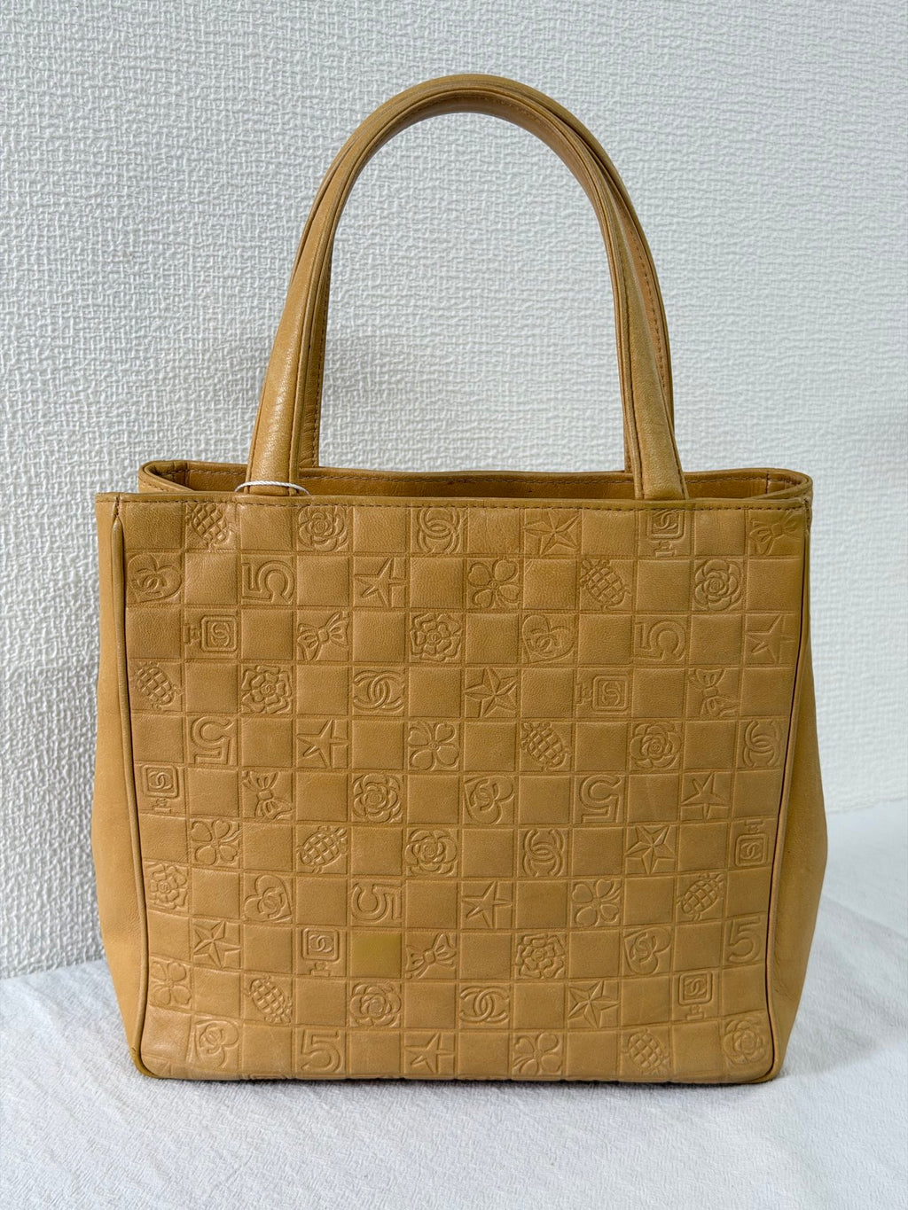 CHANEL Icon Line Embossed Tote Bag