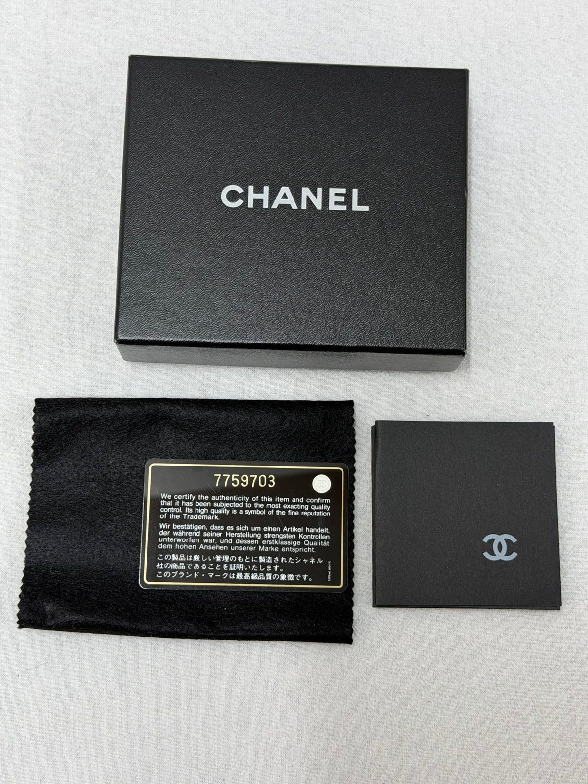 CHANEL Double C Cavier Trifold Wallet